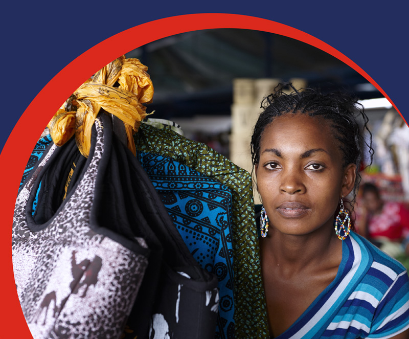 Izwe Ghana Savings for you | Personal Savings account | Woman at shop with bags | Mobi banner
