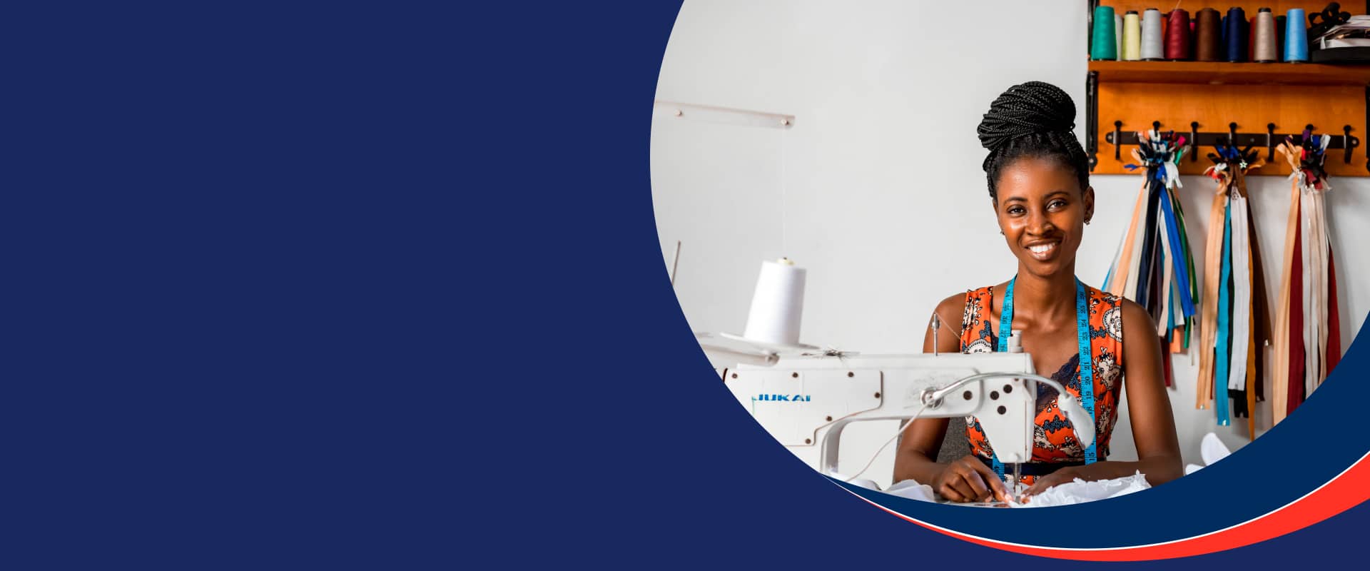 Professional sitting in front of sewing machine smiling with measuring take over her shoulders